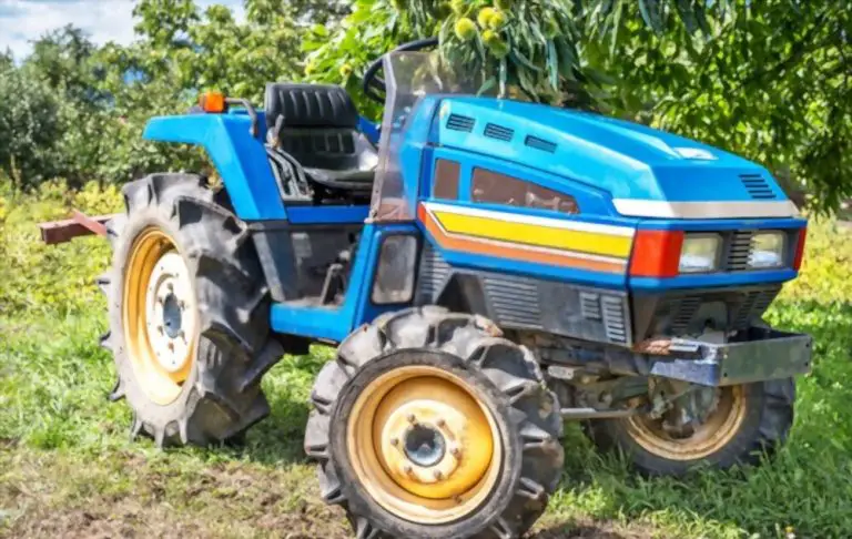 Blue compact tractor on farm